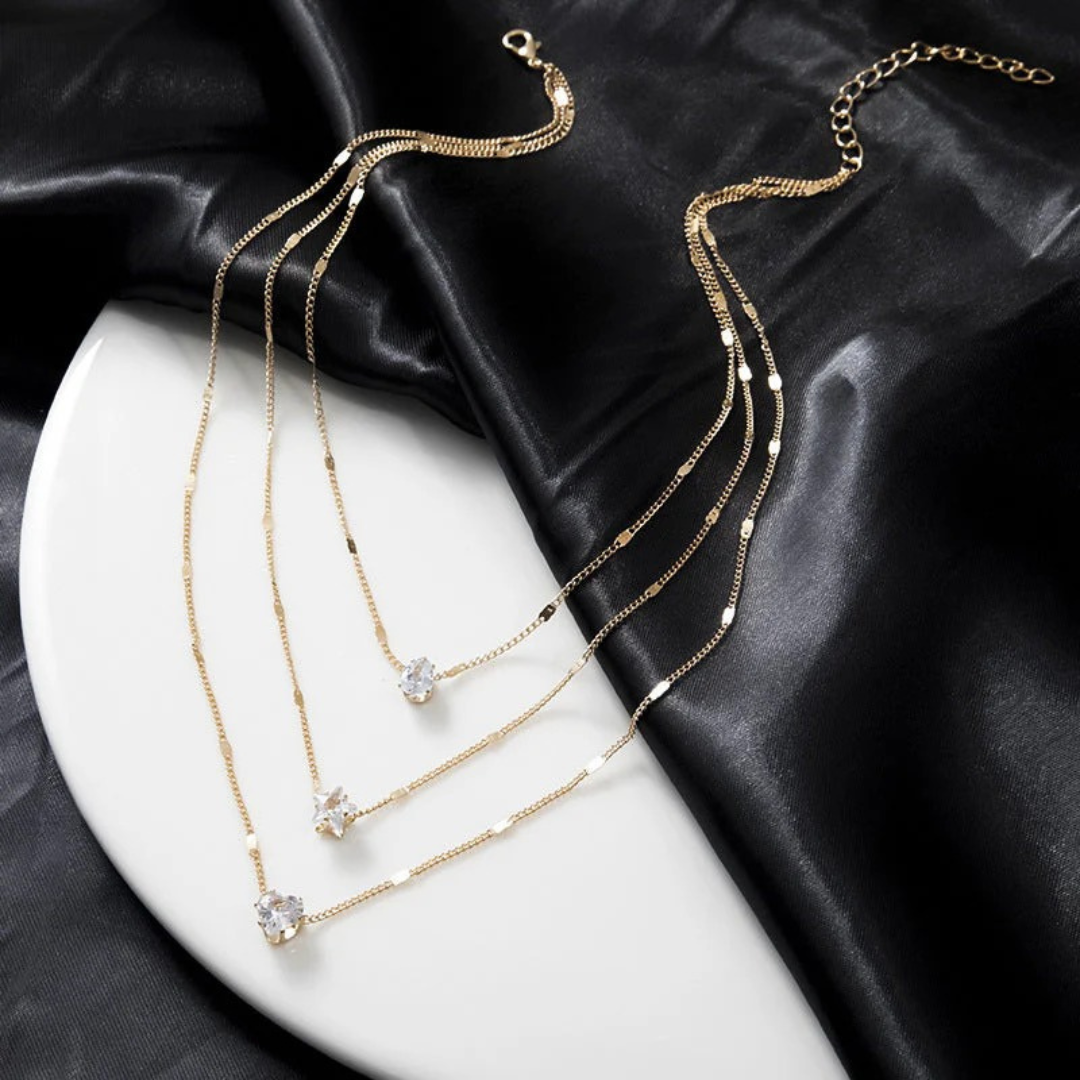 MÓNICA | COLLAR MULTICAPA CON DIJES DE CRISTAL